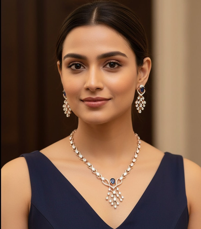 Woman wearing rose gold diamond and blue sapphire necklace set — party wear and gifting jewelry in Dubai, UAE