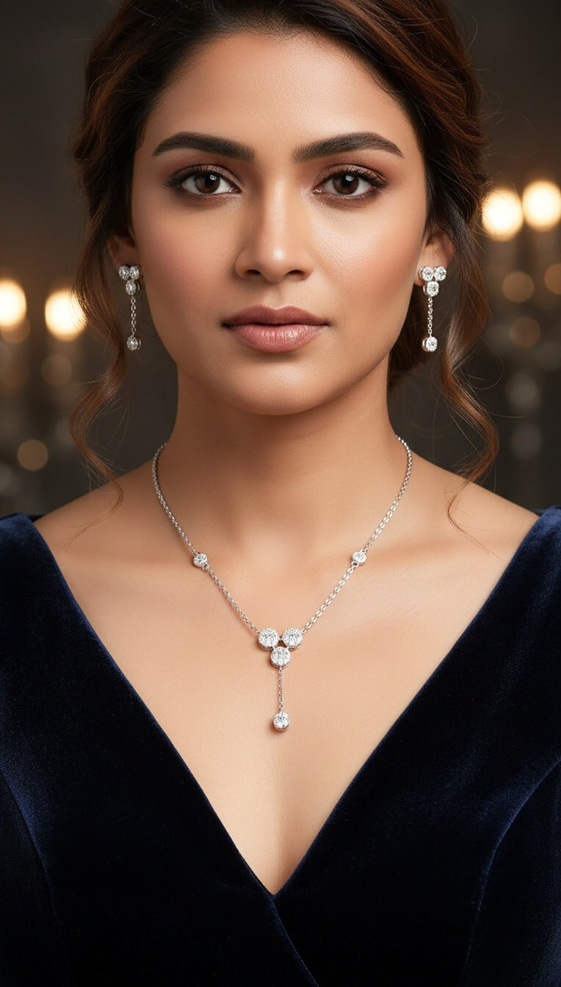 Lady wearing 18K white gold diamond trio-drop necklace set, evening and party wear for Emirati and Khaleeji women, J.H. Jewellers Dubai.