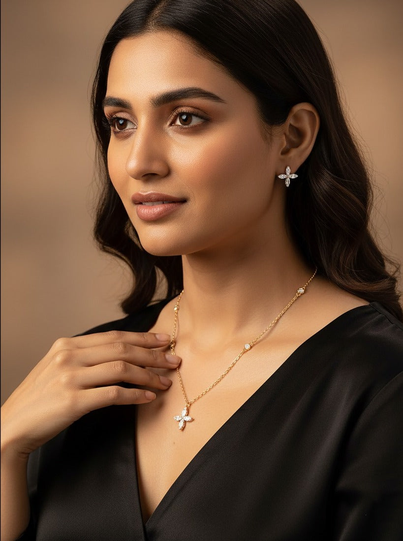 Lady wearing 18K yellow gold diamond clover necklace set, evening and party wear for Emirati and Khaleeji women, J.H. Jewellers Dubai.