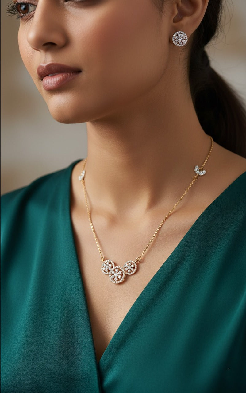 Lady wearing 18K yellow gold diamond triple circle necklace set, evening and party wear for Emirati and Khaleeji women, J.H. Jewellers Dubai.