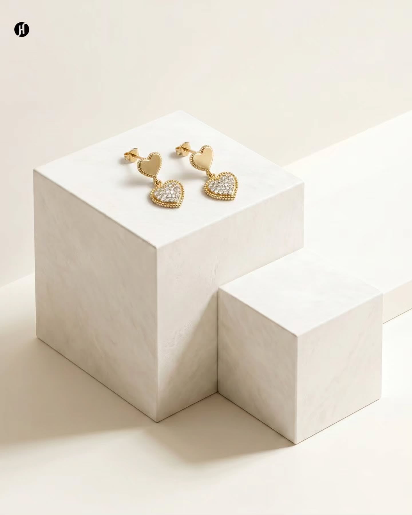 21K yellow gold double heart pendant earrings with a pavé heart — Khaleeji and Emirati women's jewellery, Dubai, UAE.