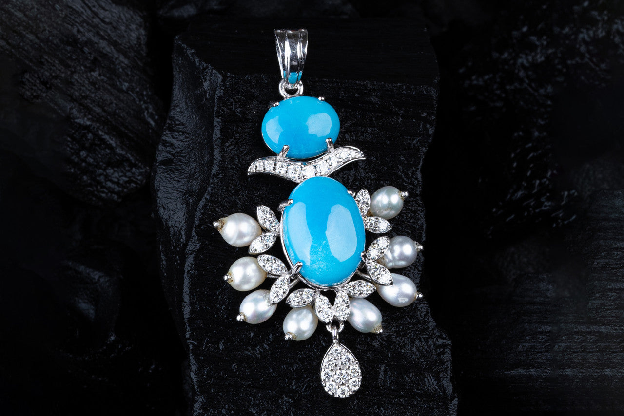 18K White Gold Diamond Pendant with Feroza and Fresh water Pearls
DIAMOND GEMSTONE JEWELLERY
NAVRATNA DIAMOND JEWELLERY
18K DIAMOND EARRINGS
18K DIAMOND RINGS
DIAMOND WEDDING SET
DIAMOND GIFT FOR WIFE