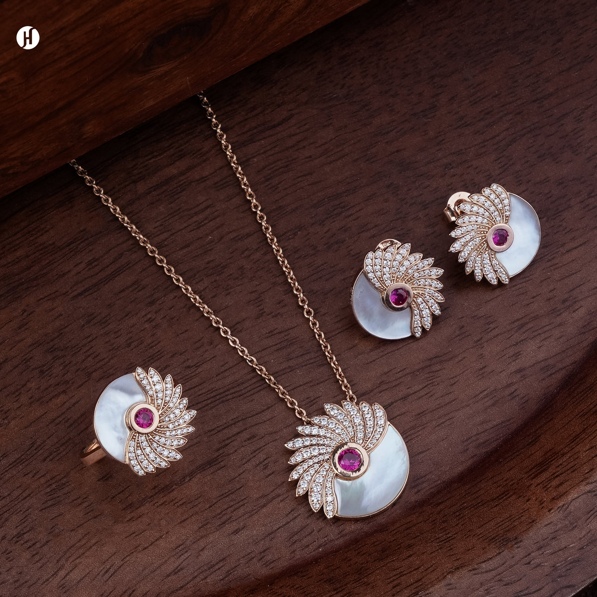 18K rose gold Italian mother-of-pearl and ruby wing necklace set with matching earrings and ring, loved by Emirati and Khaleeji ladies — JH Jewellers, Dubai, UAE