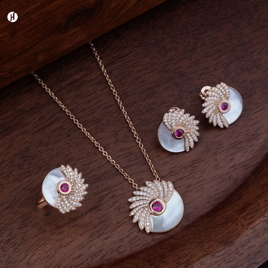 18K rose gold Italian mother-of-pearl and ruby wing necklace set with matching earrings and ring, loved by Emirati and Khaleeji ladies — JH Jewellers, Dubai, UAE