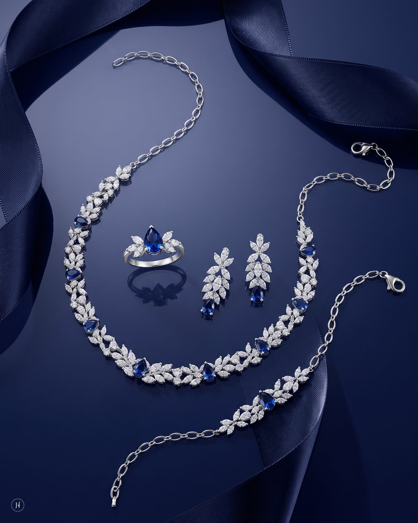 18K white gold blue sapphire and zircon leaf necklace set with matching earrings, bracelet and ring, blue sapphire wedding and party wear, J.H. by Priyansh Jewellery, Dubai, UAE.