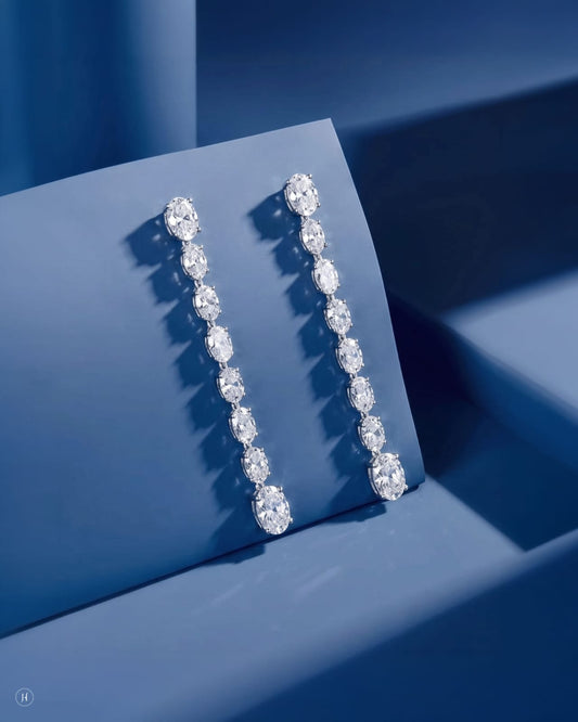 18K white gold lab grown diamond oval line drop earrings, graduated oval DEF VVS diamonds for weddings and party wear, J.H. by Priyansh Jewellery, Dubai, UAE.
