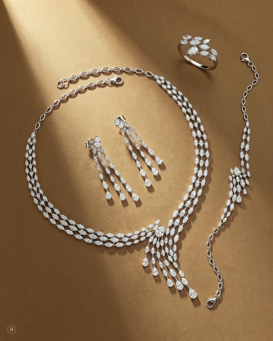 18K white gold Italian zircon leaf vine necklace set with matching earrings, bracelet and ring, white and yellow zircon wedding and party wear, J.H. by Priyansh Jewellery, Dubai, UAE.