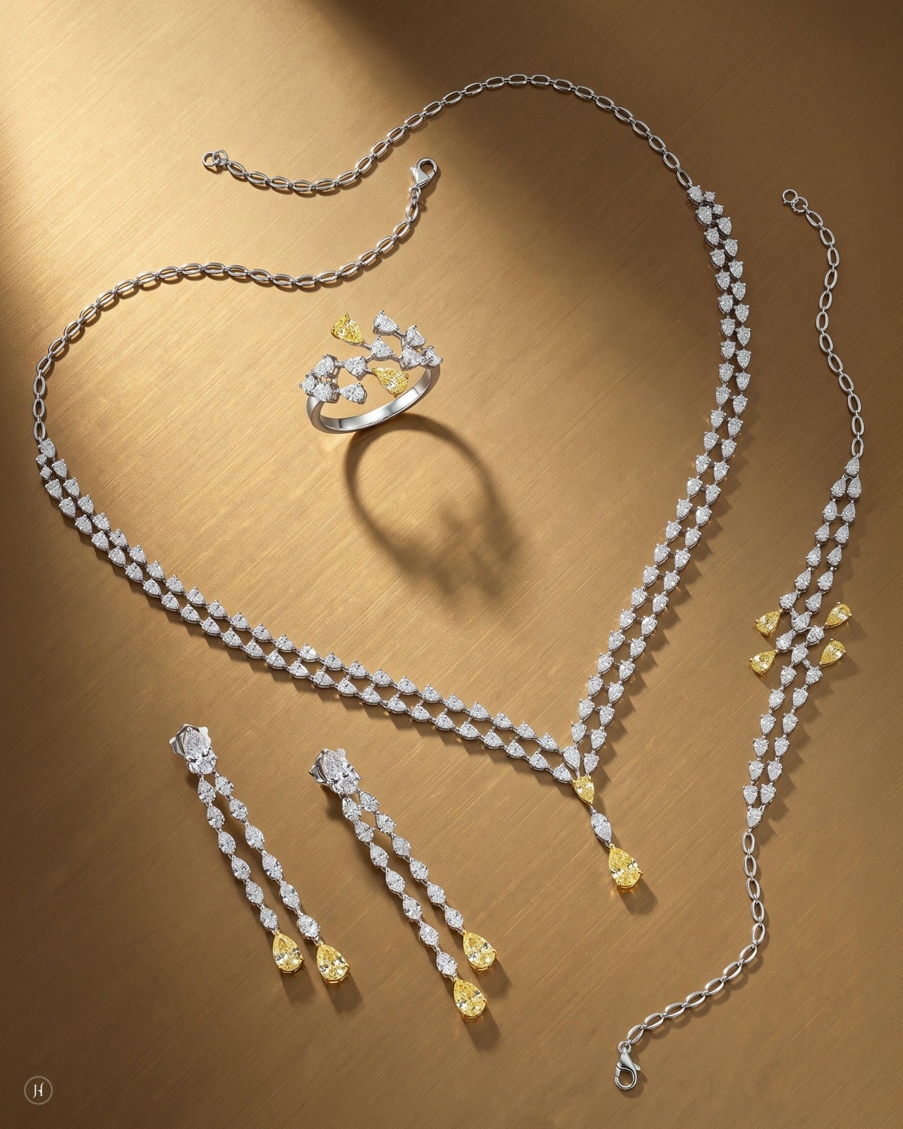 18K white gold Italian zircon pear-drop necklace set with matching earrings, bracelet and ring, white and yellow zircon wedding and party wear, J.H. by Priyansh Jewellery, Dubai, UAE.