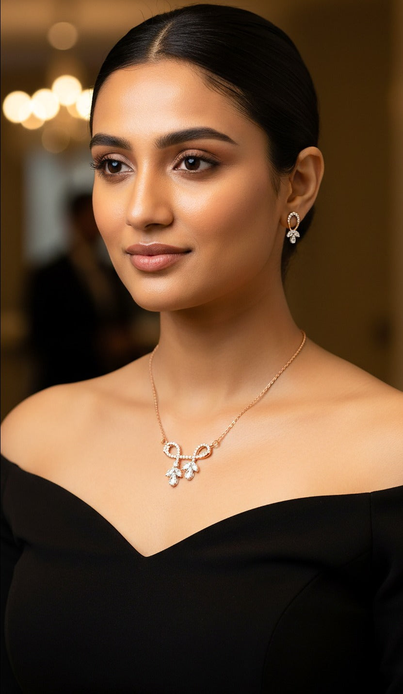 Lady wearing 18K rose gold diamond bow necklace set, evening and party wear for Emirati and Khaleeji women, J.H. Jewellers Dubai.