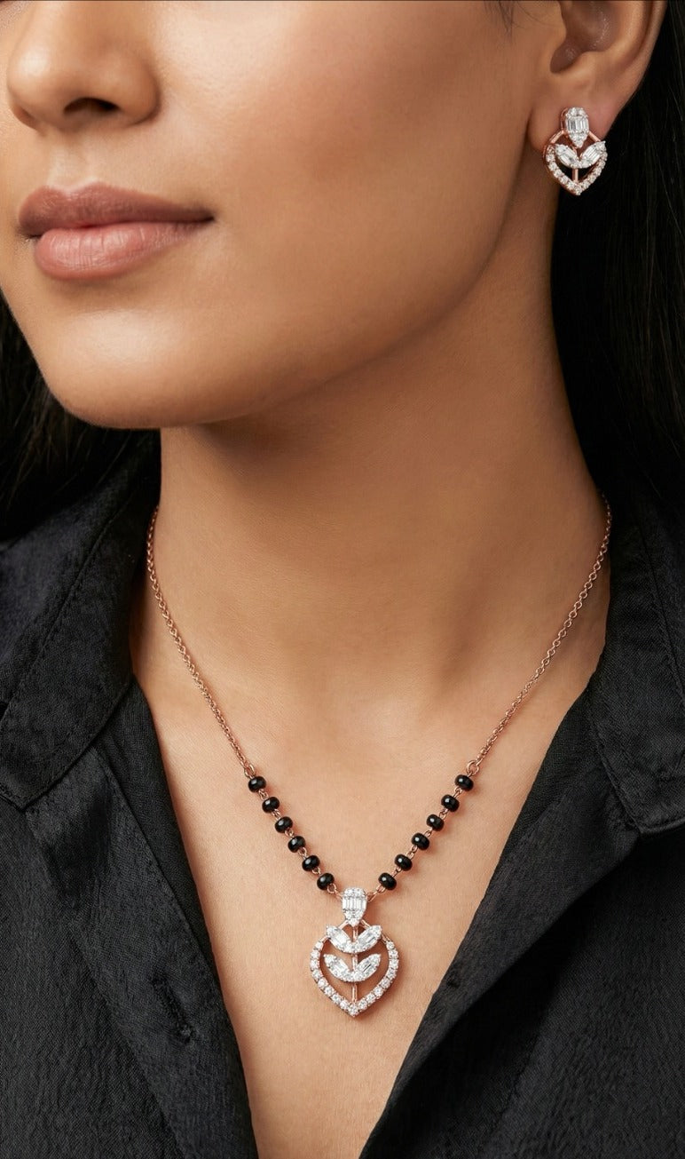 Woman wearing an 18K rose gold diamond heart necklace set, perfect for daily wear and gifting