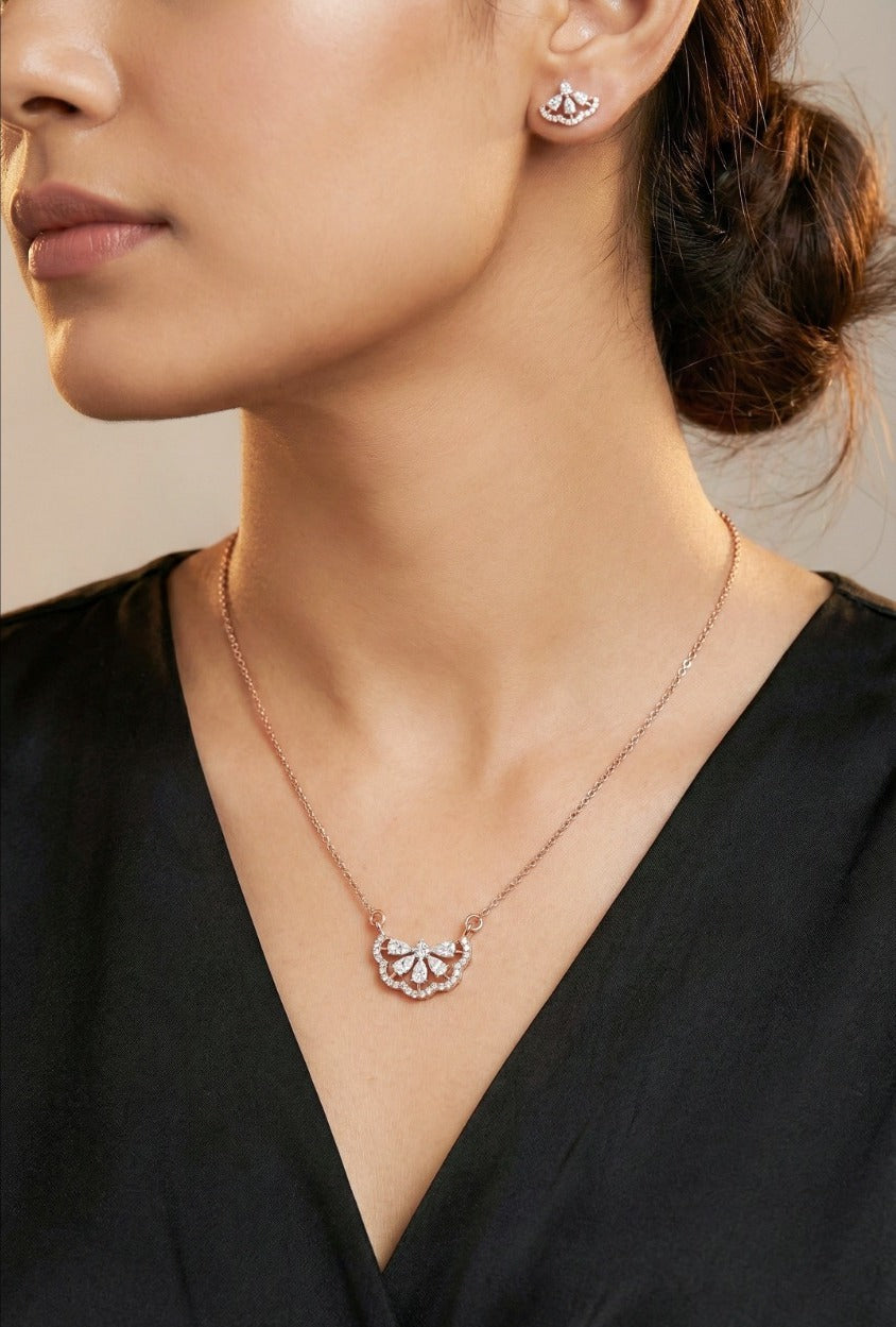 Woman wearing an 18K rose gold diamond scallop fan necklace set, ideal for Emirati and Khaleeji ladies at parties and weddings