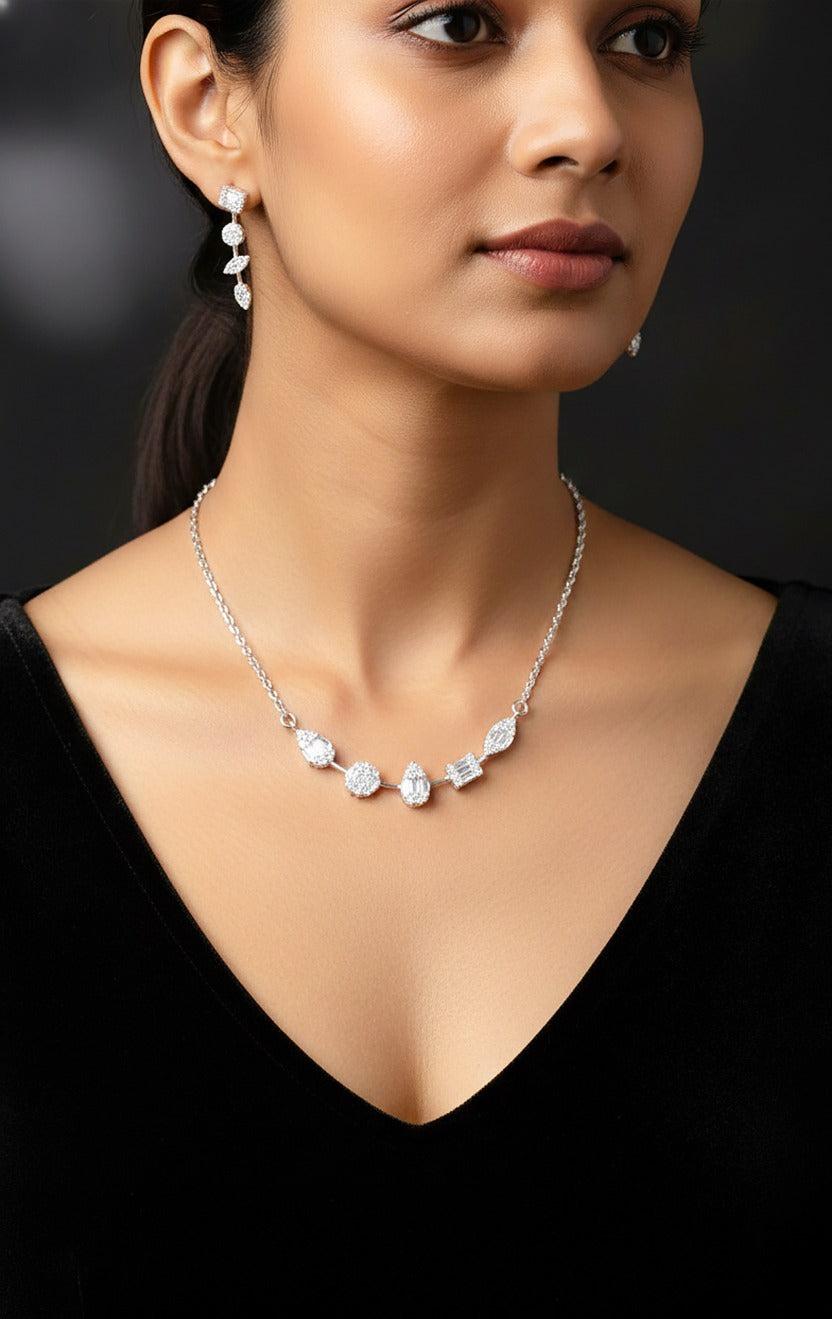 Lady wearing 18K white gold diamond cluster necklace set, evening and party wear for Emirati and Khaleeji women, J.H. Jewellers Dubai.