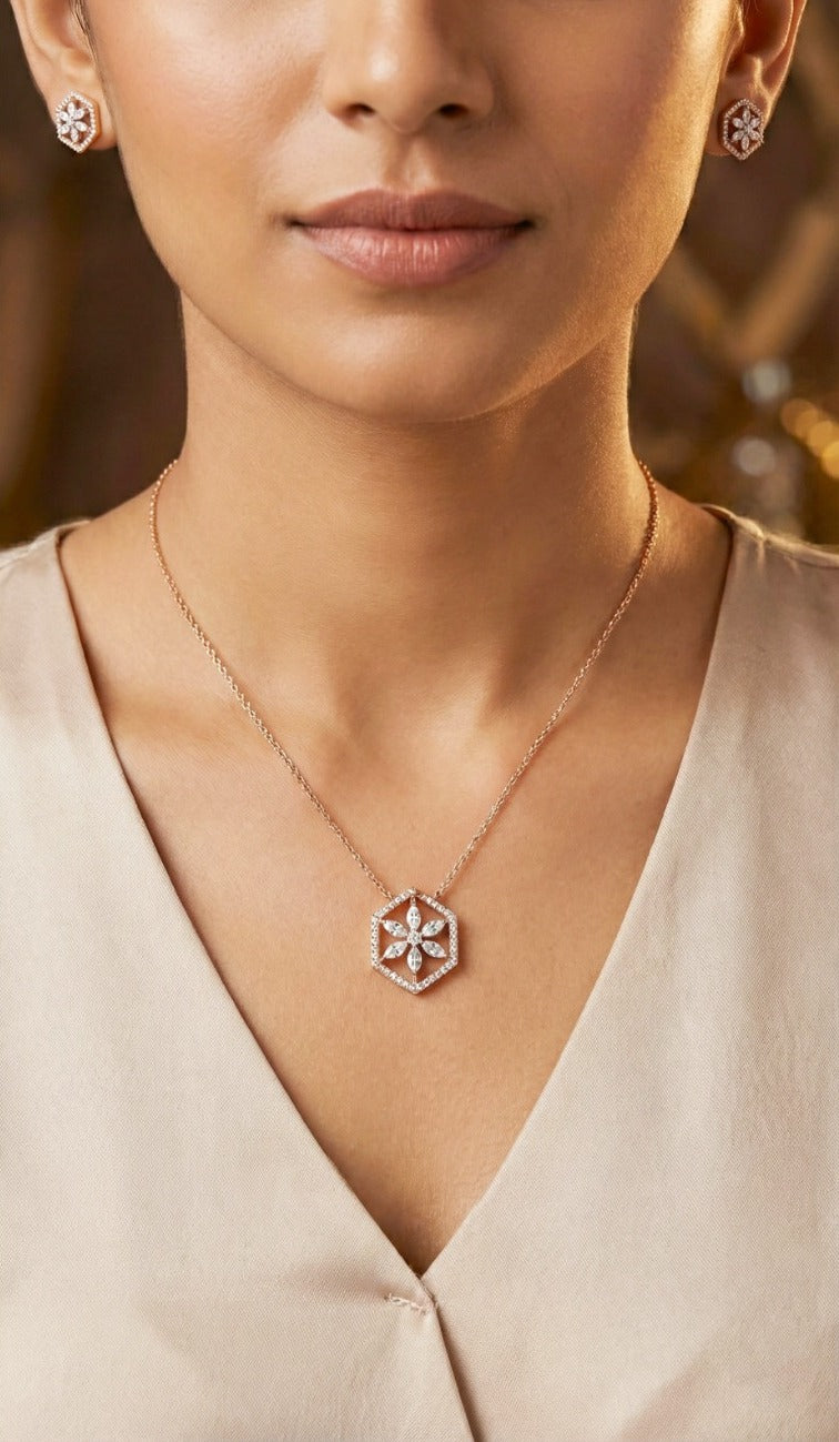 Woman wearing an 18K yellow gold diamond hexagon flower necklace set, ideal for Emirati and Khaleeji ladies at parties and weddings