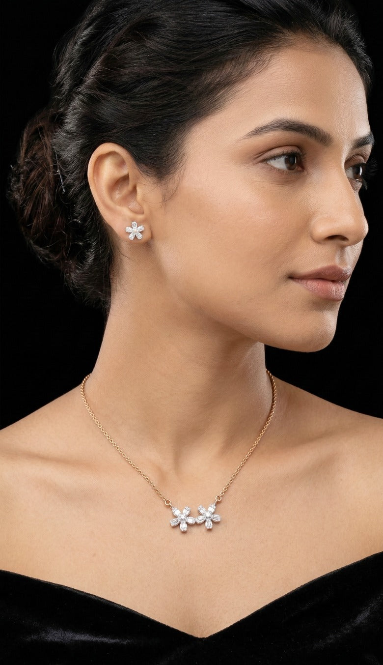 Woman wearing an 18K yellow gold diamond twin flower necklace set, ideal for Emirati and Khaleeji ladies