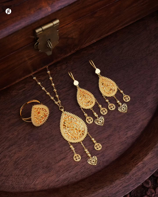 21K yellow gold Arabic teardrop filigree pendant necklace set with matching chandelier earrings and ring, loved by Emirati and Khaleeji women, J.H Jewellers UAE.