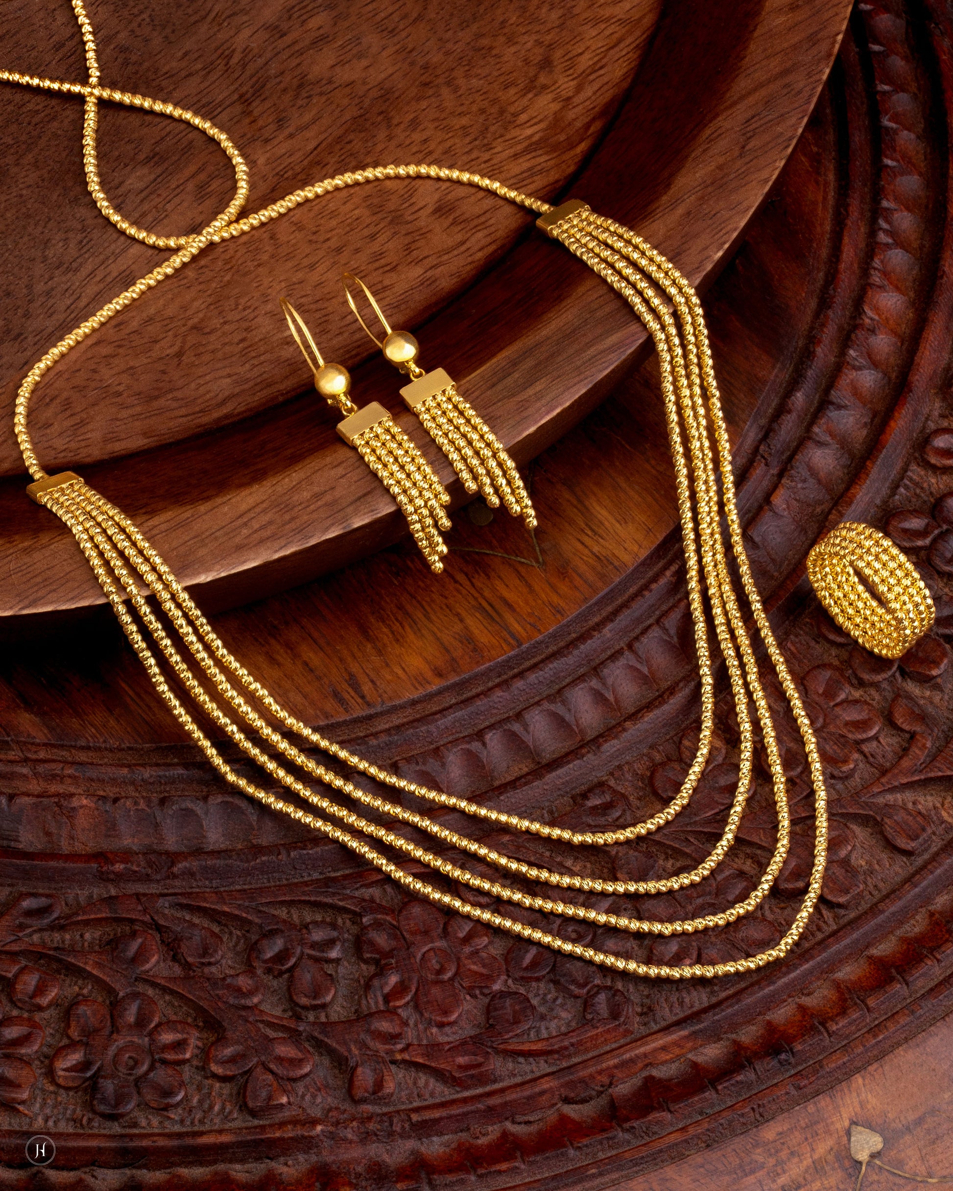 21K yellow gold Bahraini multi-strand beaded necklace with rectangular bead-textured sections and cascading gold chains