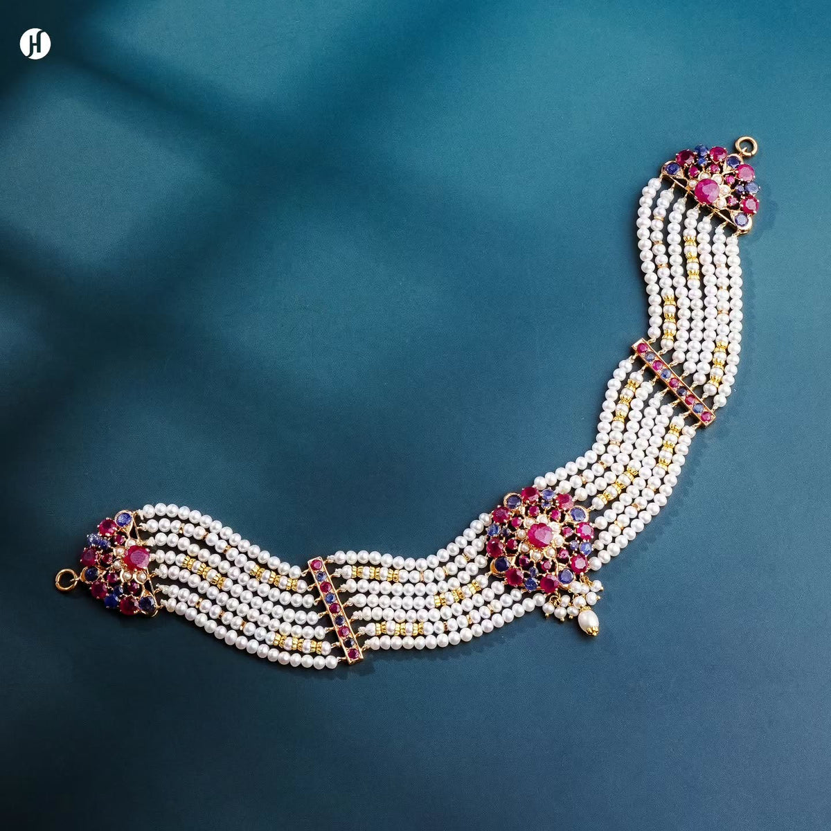 21K yellow gold Pakistani multi-strand freshwater pearl choker with ruby and blue sapphire flower stations