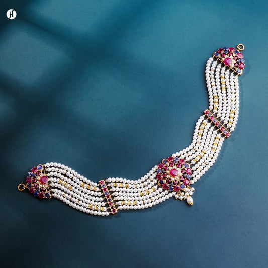 21K yellow gold Pakistani multi-strand freshwater pearl choker with ruby and blue sapphire flower stations