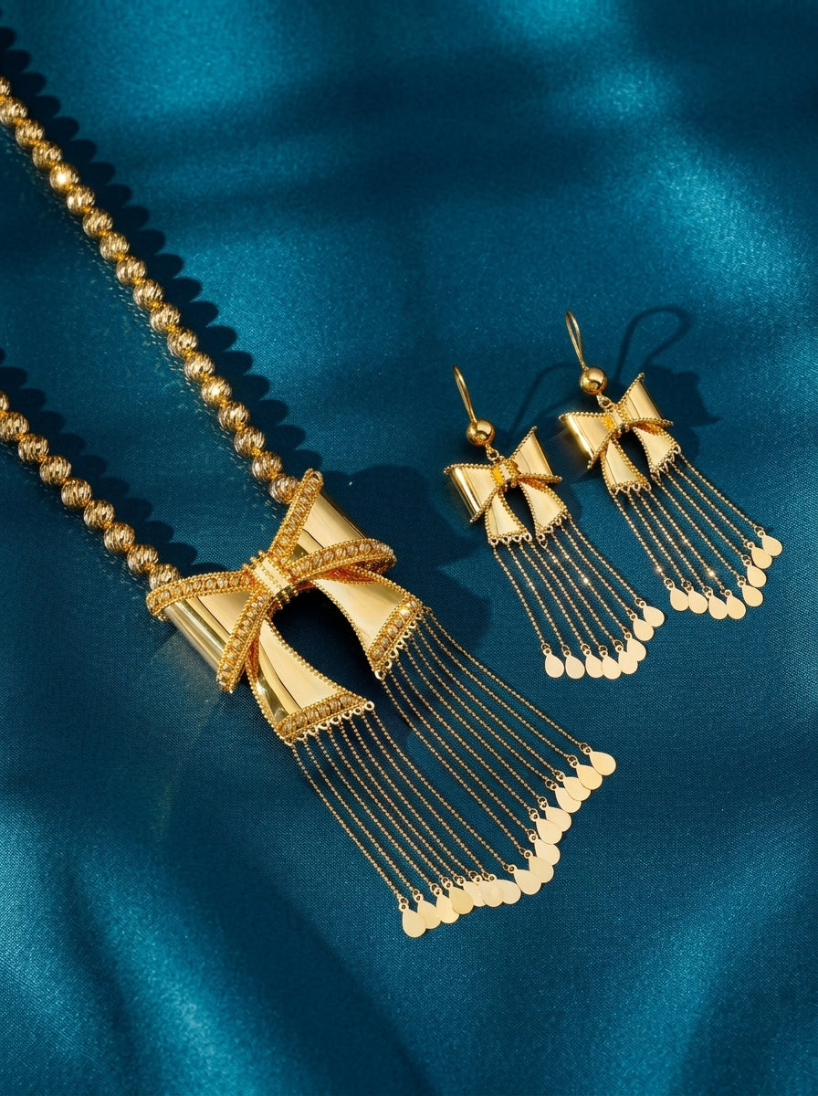 21Karat Yellow Gold Bahraini Bow Tassel Necklace Set | perfect for weddings and special occasions, making a bold and luxurious statement for Khaleeji and Emirati brides and women. It complements any outfit, including the Abaya.