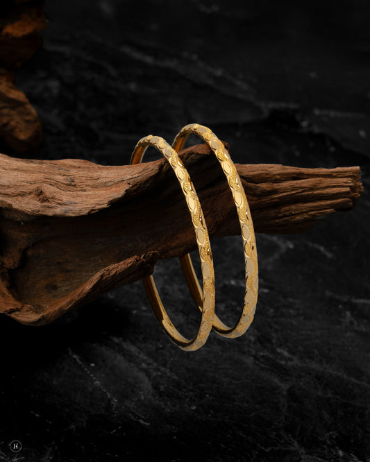 21Karat Yellow Gold Bahraini Oval-Pattern Bangles price in Dubai, UAE - J.H Jewellers.