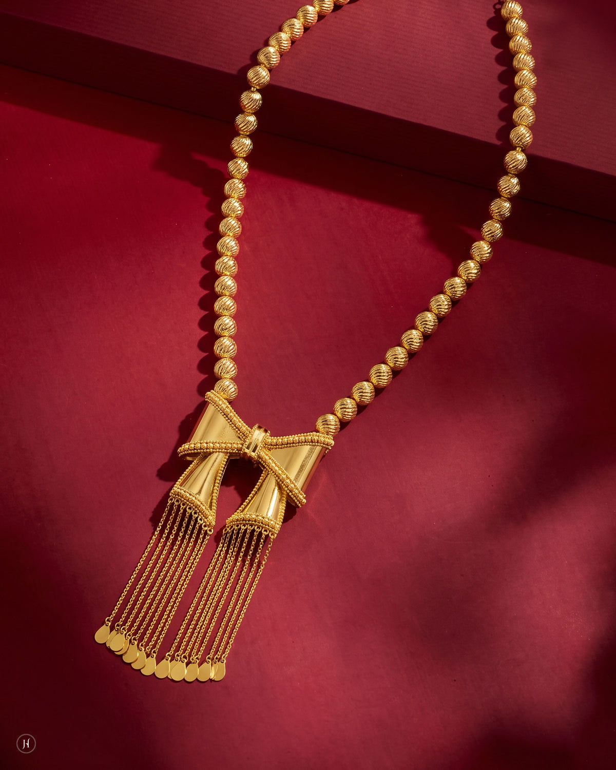 21K yellow gold Bahraini bow tassel necklace on a diamond-cut bead chain, for Emirati and Khaleeji women, J.H. by Priyansh Jewellery, Dubai, UAE.