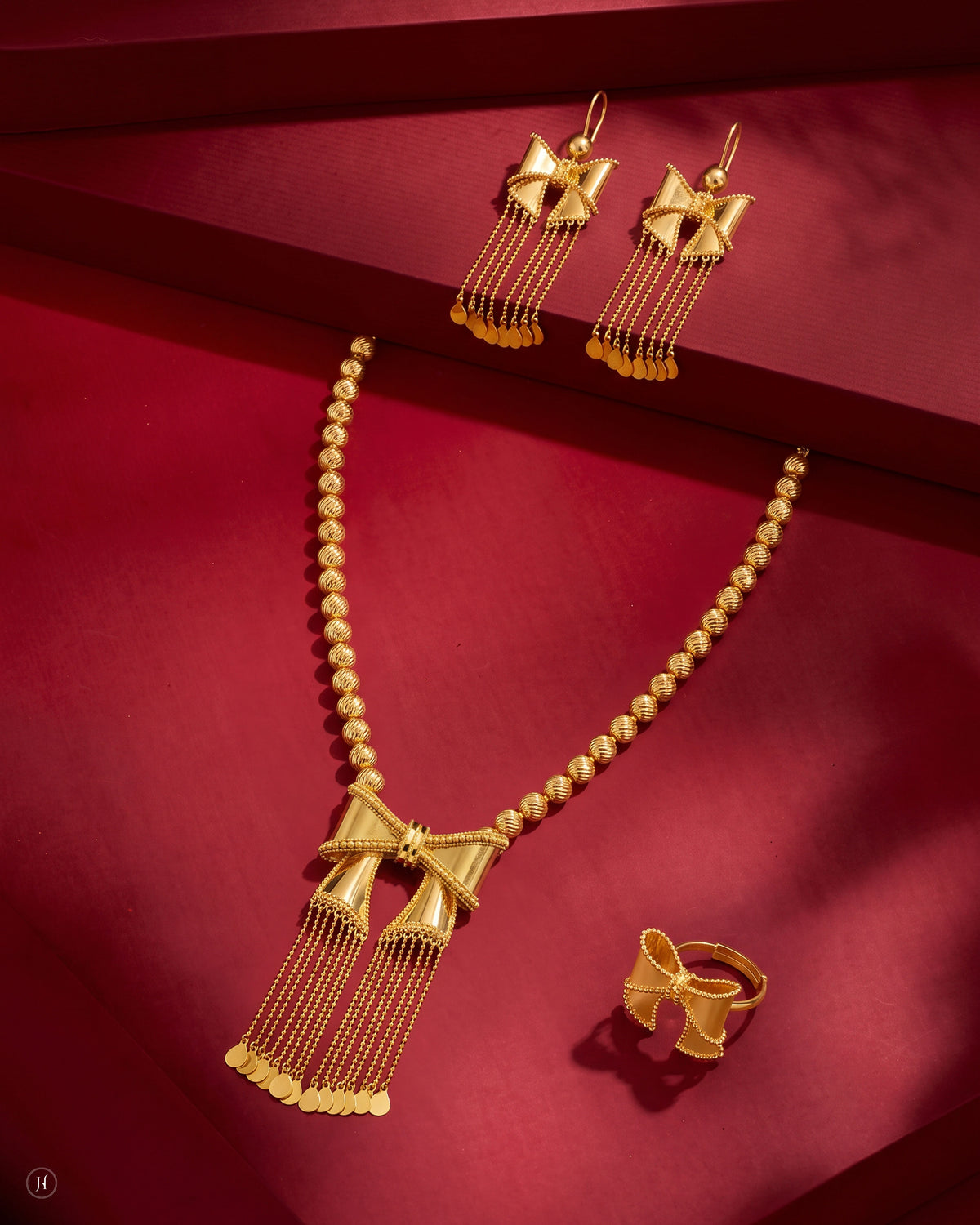 21K yellow gold Bahraini bow tassel necklace set with matching earrings and ring, loved by Emirati and Khaleeji women, J.H. by Priyansh Jewellery, Dubai, UAE.