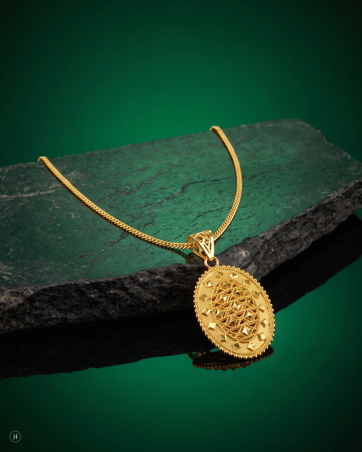 21K yellow gold Bahraini filigree oval pendant on a fine curb chain, loved by Emirati and Khaleeji women, J.H. by Priyansh Jewellery, Dubai, UAE.