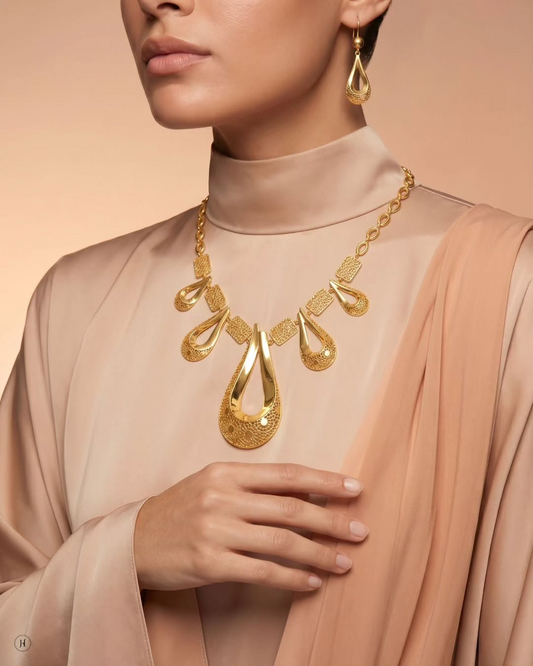 Lady wearing 21K yellow gold Bahraini filigree teardrop necklace — Emirati and Khaleeji bridal jewellery, Dubai, UAE.