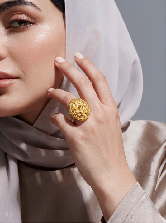 Lady wearing a 21K yellow gold Bahraini floral filigree dome ring, statement gold jewellery for Emirati and Khaleeji women, J.H. by Priyansh Jewellery, Dubai, UAE.