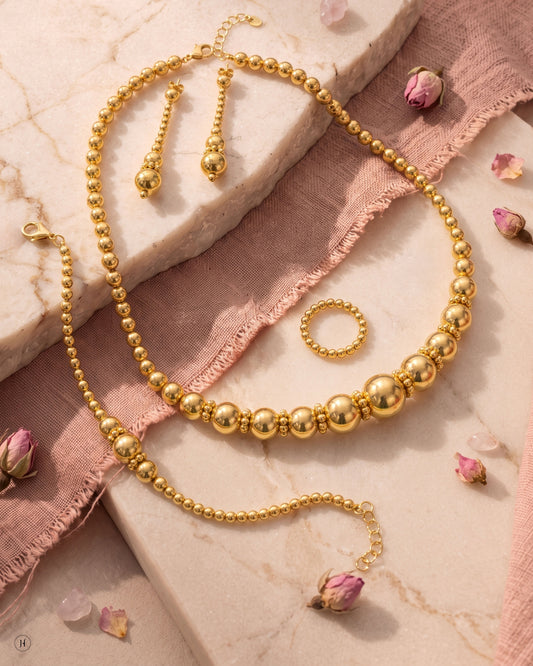 21K yellow gold Bahraini gold ball necklace set with bead-drop earrings, bracelet and ring — Emirati and Khaleeji women's jewellery, Dubai, UAE.