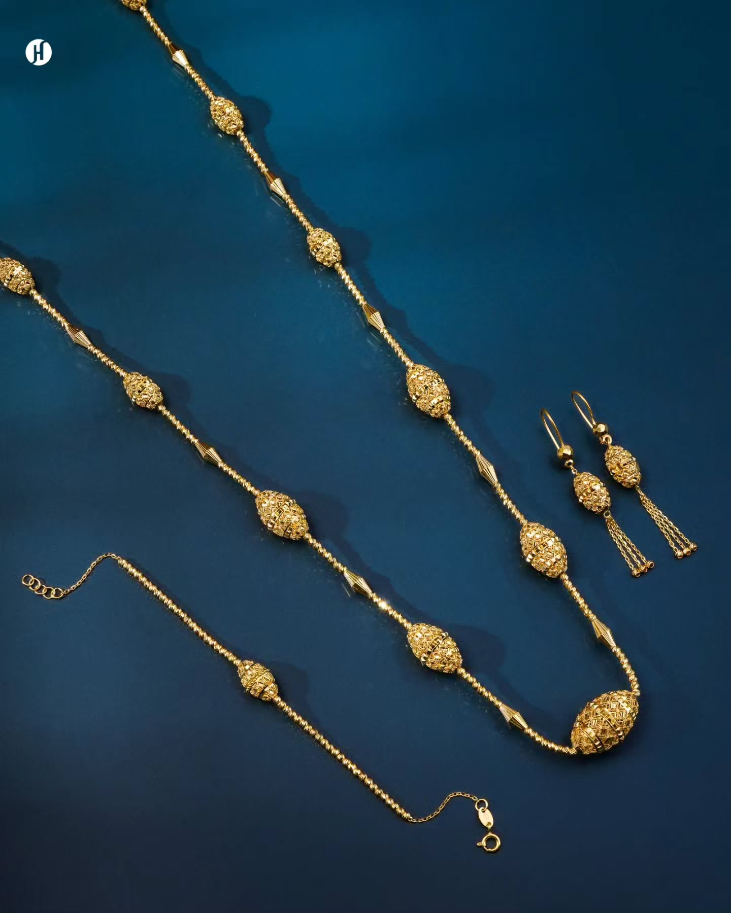 21K yellow gold Bahraini textured oval bead long chain necklace set with matching bracelet and earrings, loved by Emirati and Khaleeji women, J.H. Jewellers, Shop No. 13/14, Block No. 8, New Central Market, Sharjah, UAE.