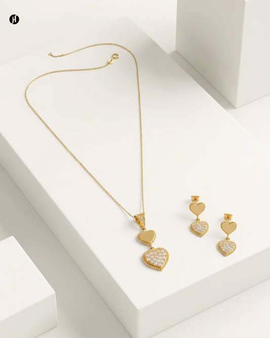 21K yellow gold double heart pendant necklace set with pavé heart and matching drop earrings — a love gift for Emirati and Khaleeji women, Dubai, UAE.