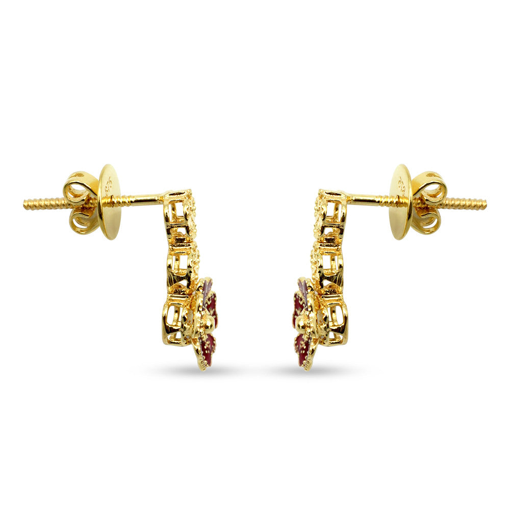 Side profile of 21K yellow gold drop screw back earrings with flower motif and Meena work