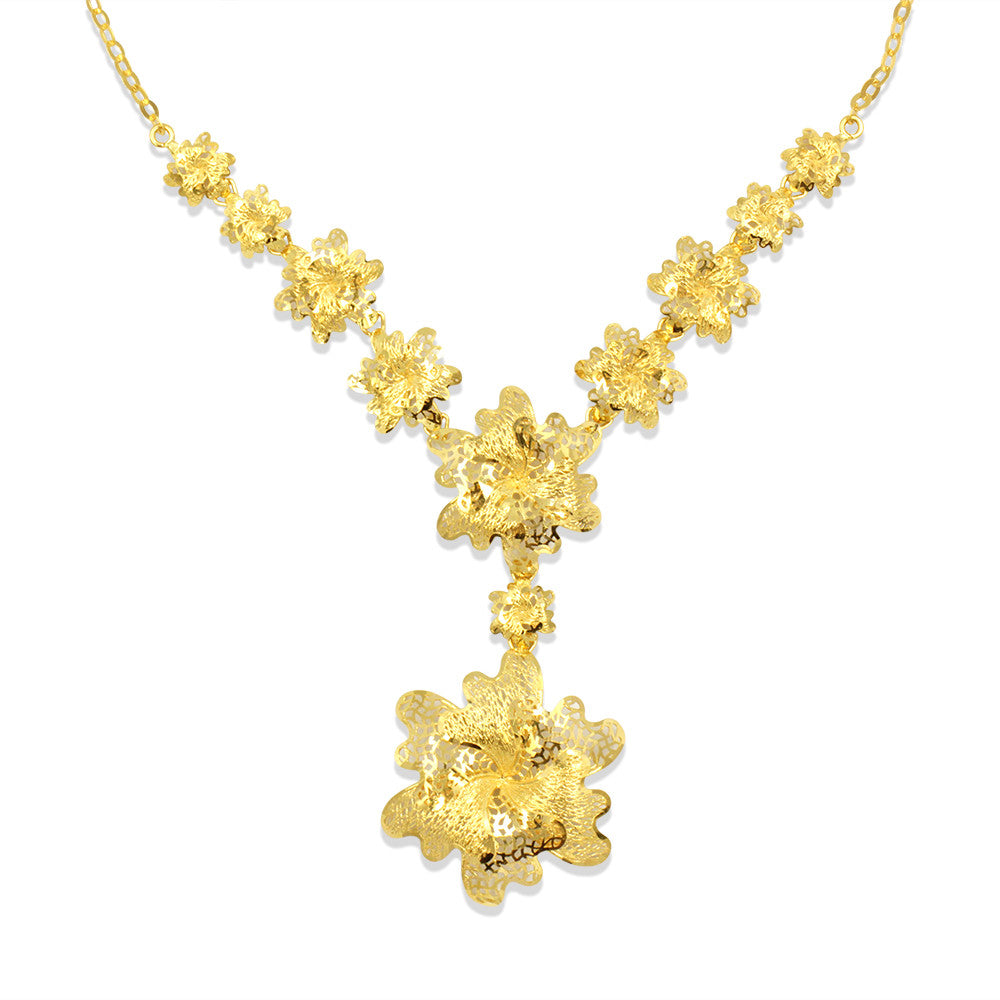 Close up of matinee length 21K yellow gold Bahraini Embossed Flower necklace